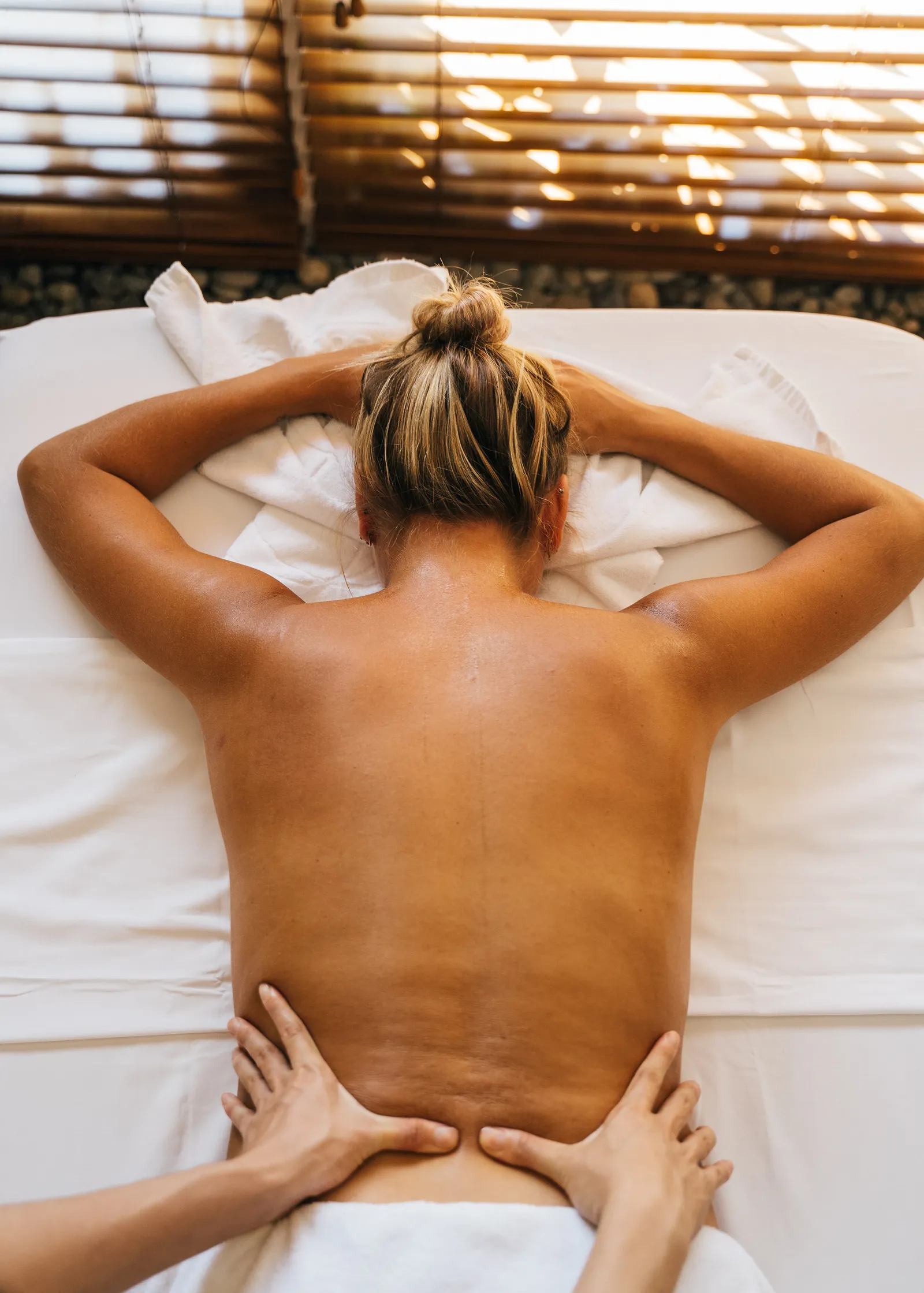 Professional Swedish massage with gentle flowing strokes in a calm spa room