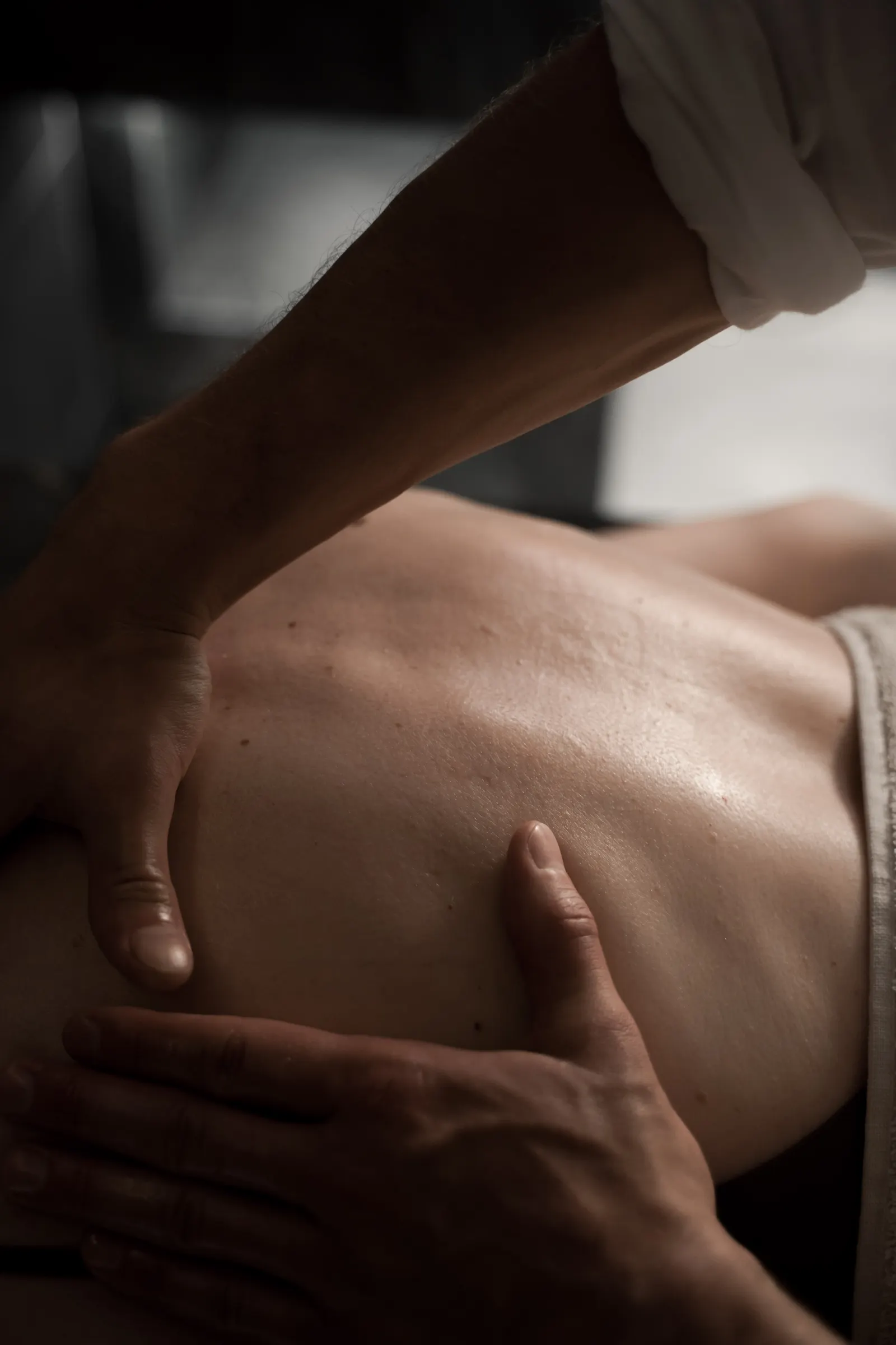 Therapeutic deep tissue massage with focused, firm pressure on the back